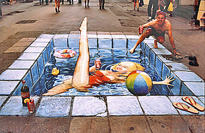 The pavement /sidewalk drawing is now seen from the correct perspective and is of a woman in a swimming pool in a red swimsuit